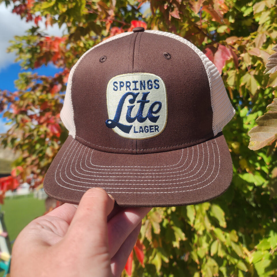Red Leg Springs Lite Lager Brown and Beige Trucker Hat